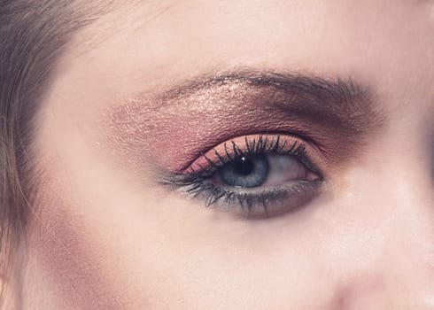 female eye closeup with makeup