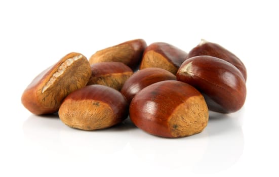 delicious chestnuts closeup over white