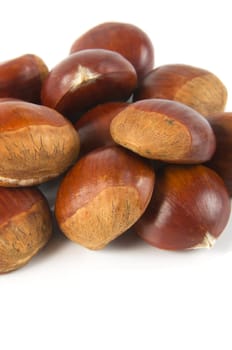 delicious chestnuts closeup over white