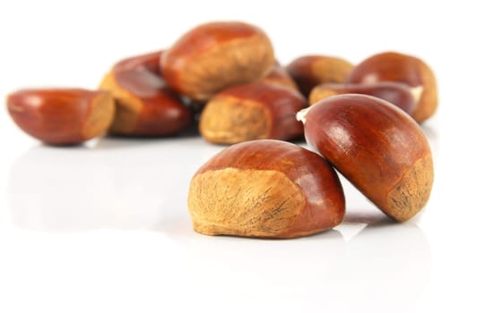 delicious chestnuts closeup over white