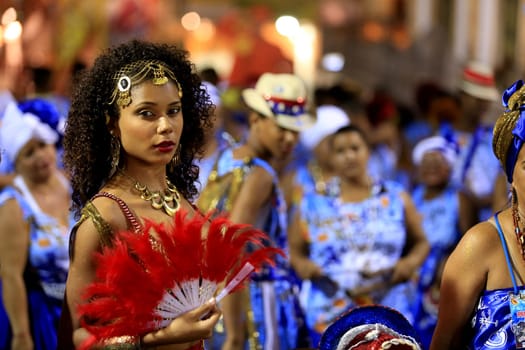 salvador, bahia - brazil - march 4, 2016: members of the carnival block Afoxe Laroye are seen wearing Orix costumes from Candomble at Circuito Batatinha (Pelourinho) during the carnival in the city of Salvador.