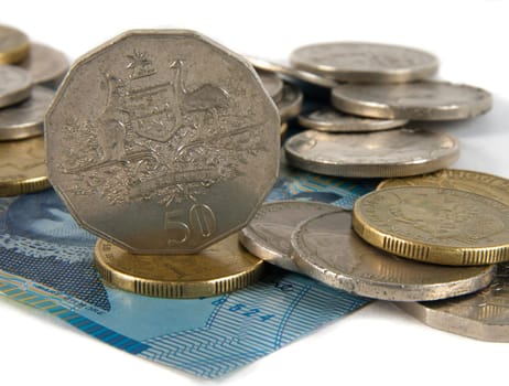 australian cash and coins over white