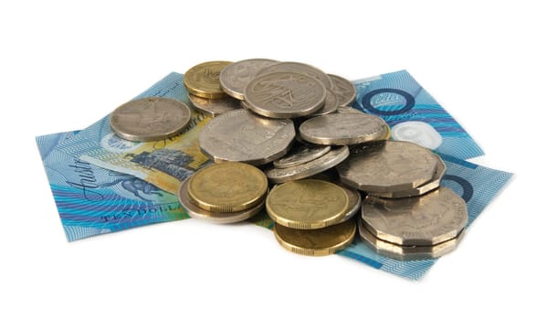 australian cash and coins over white