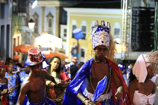 salvador, bahia - brazil - march 4, 2016: members of the carnival block Afoxe Laroye are seen wearing Orix costumes from Candomble at Circuito Batatinha (Pelourinho) during the carnival in the city of Salvador.