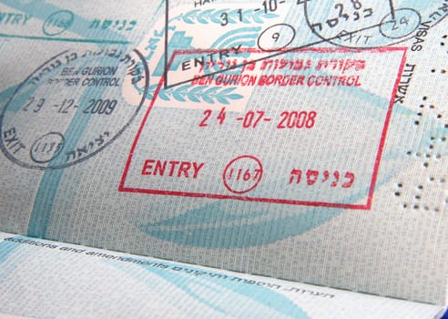 visa stamps in open passport page