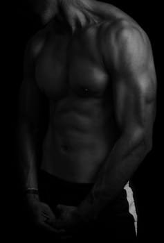 shape of sporty male body on dark
