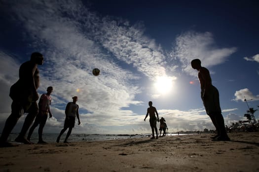 salvador, bahia / brazil - december 22, 2015: people are seen playing football on Itapua beach in the city of Salvador.....