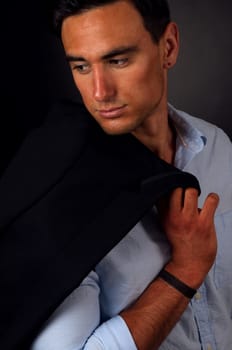 portrait of the elegant man on dark