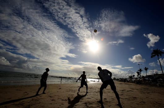 salvador, bahia / brazil - december 22, 2015: people are seen playing football on Itapua beach in the city of Salvador.....