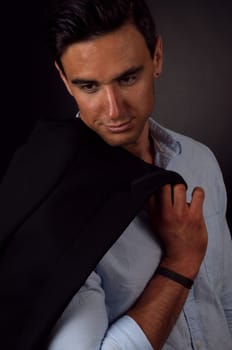 portrait of the elegant man on dark