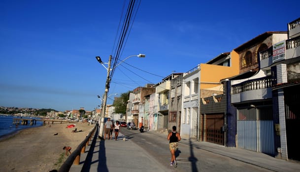 salvador, bahia / brazil - december 2, 2015: people are seen walking on Avenida Beira Mar in the Ribeira neighborhood in the city of Salvador..