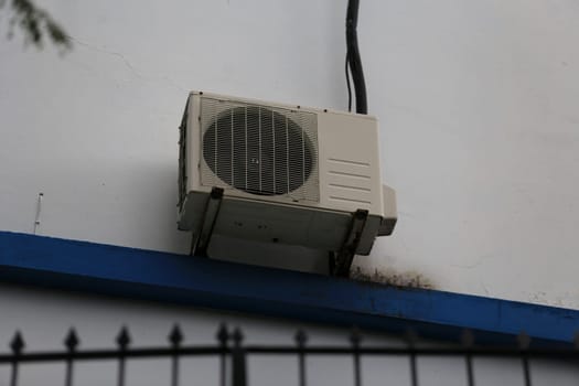 salvador, bahia - brazil - april 17, 2019: air conditioning condenser is seen on the wall of a residence in the city of Salvador..