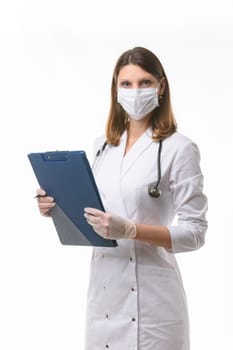 Portrait of a doctor girl in a medical mask and gloves