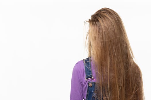 Teen girl covered her face with long hair