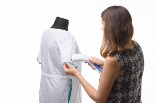 Girl steals a medical gown isolated on a white background