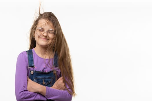 A girl of eleven from the wind tangled in long hair