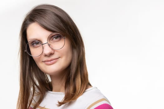 Closeup portrait of european girl in round glasses