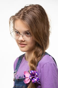 Portrait of a girl in round glasses with an interesting and distracted look