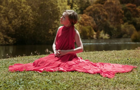 woman with beautiful dress by the lake