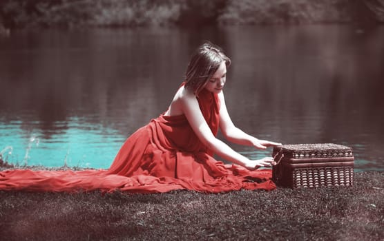 woman with beautiful dress by the lake