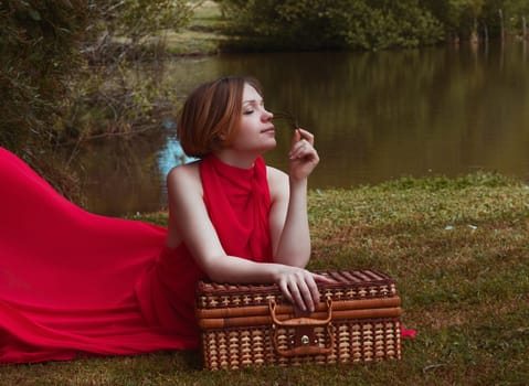 woman with beautiful dress by the lake