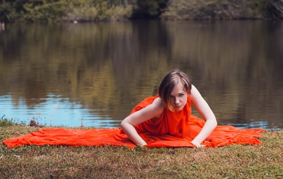 woman with beautiful dress by the lake