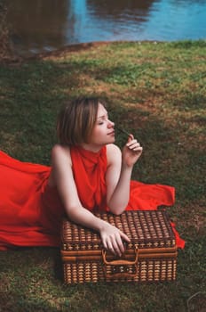 woman with beautiful dress by the lake