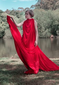 woman with beautiful dress by the lake