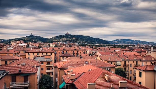 View of rooftops and suburban hills in Bologna, Italy