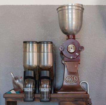 old coffee grinder with coffee beans in closeup