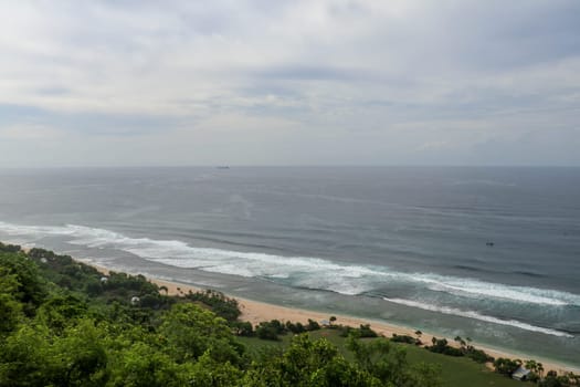 Bubble hotel at Nyang Nyang Beach on Bali Island, Indonesia. Romantic place ideal for honeymoon. A high reef off the coast of the Indian Ocean overgrown with dense tropical vegetation. Rainforest.