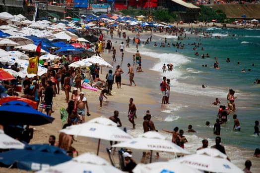 salvador, bahia / brazil - february 17, 2015: people are seen during a sea bath at Barra beach in the city of Salvador.