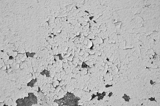 Cracked and peeling paint and grunge old wall with texture