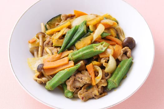 Vegetable stir fry in a plate on table. Close up