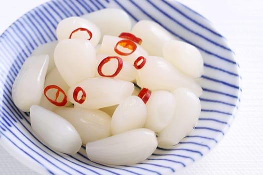 Japanese Rakkyo, Sweet and sour pickled scallions in a dish