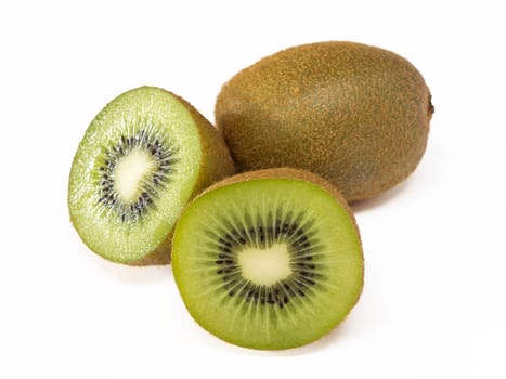 Close-up of two kiwis, one of them cut in half. Isolated on a white background. Copy space.