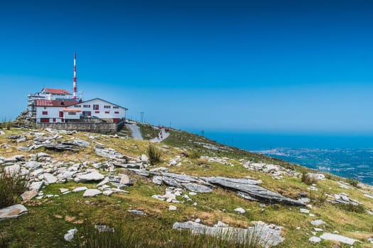 Inn and transmission antenna on the Rhune mountain in the Pyrenees Atlantiques in France