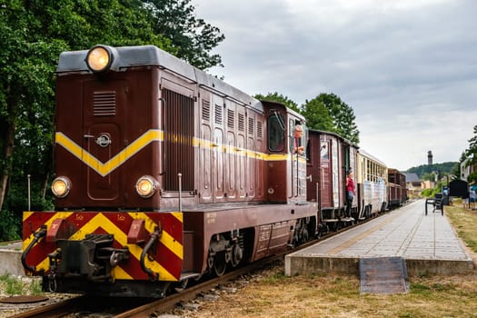 Niechorze, Poland, June 2018 Old diesel narrow gauge train departing from train station. Popular tourist attraction