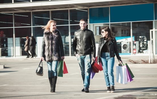 Happy friends making shopping