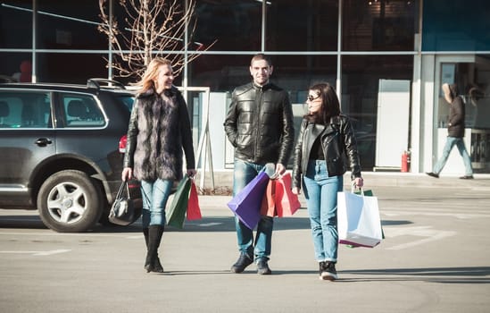 Happy friends making shopping