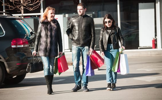 Happy friends making shopping
