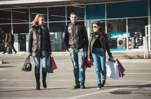 Happy friends making shopping