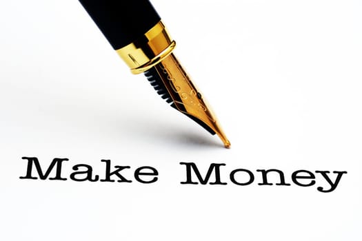 Fountain pen on make money text