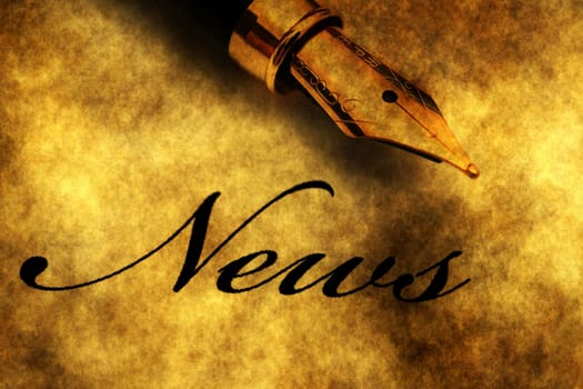 Fountain pen on news text