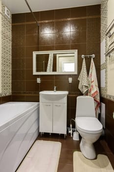 The interior of the bathroom is made in a classic style