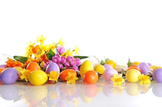 Genuine painted Easter eggs in violet,yellow and orange with flowers and palm kittens on white background