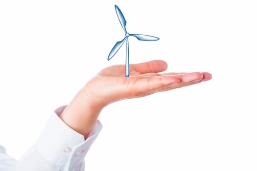 Close up on a wind turbine rising from within the open palm of a hand. Business metaphor for wind power generation, renewable energy sources and the energy turn. Cutout isolated on white background.