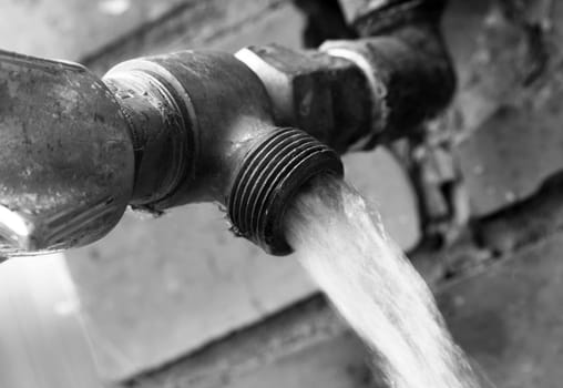 Old outdoor tap with running water