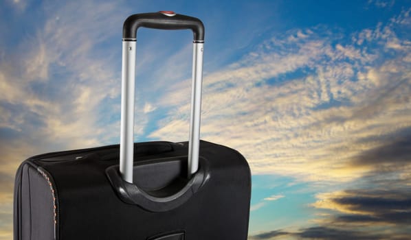 Suitcase with the sky. Travel concept
