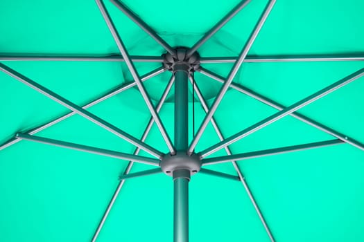 Close-up photo of under green parasol or under green umbrella.